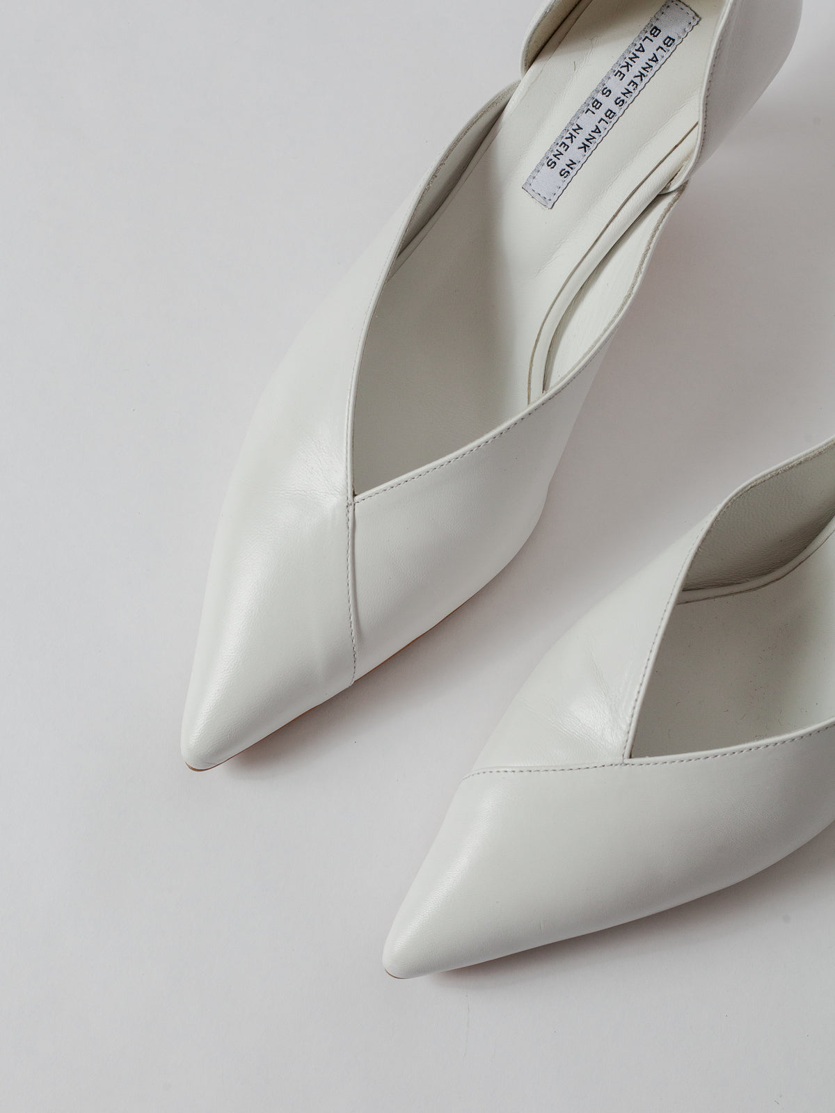 Blankens The Radford white White high-heeled shoes on a light gray background Weddings shoes White pointed-toe shoes on a light gray background