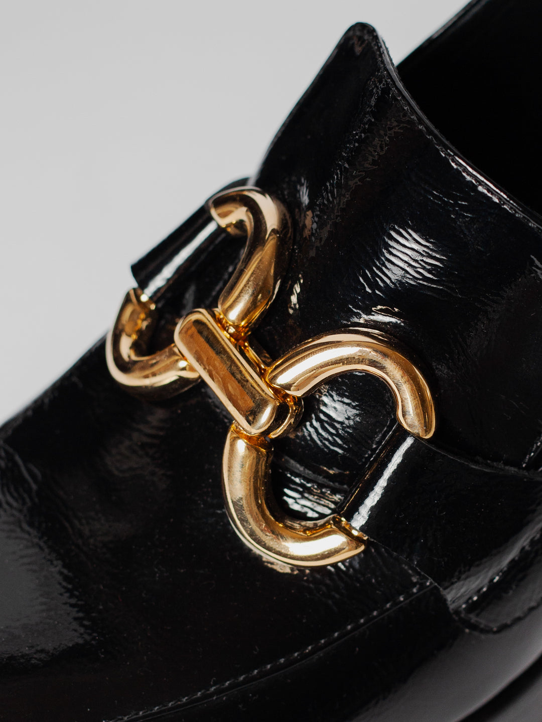 Blankens The Olivia platform heeled loafer with bold gold buckle. Comfortable and lightweight. Detail photo of buckle.