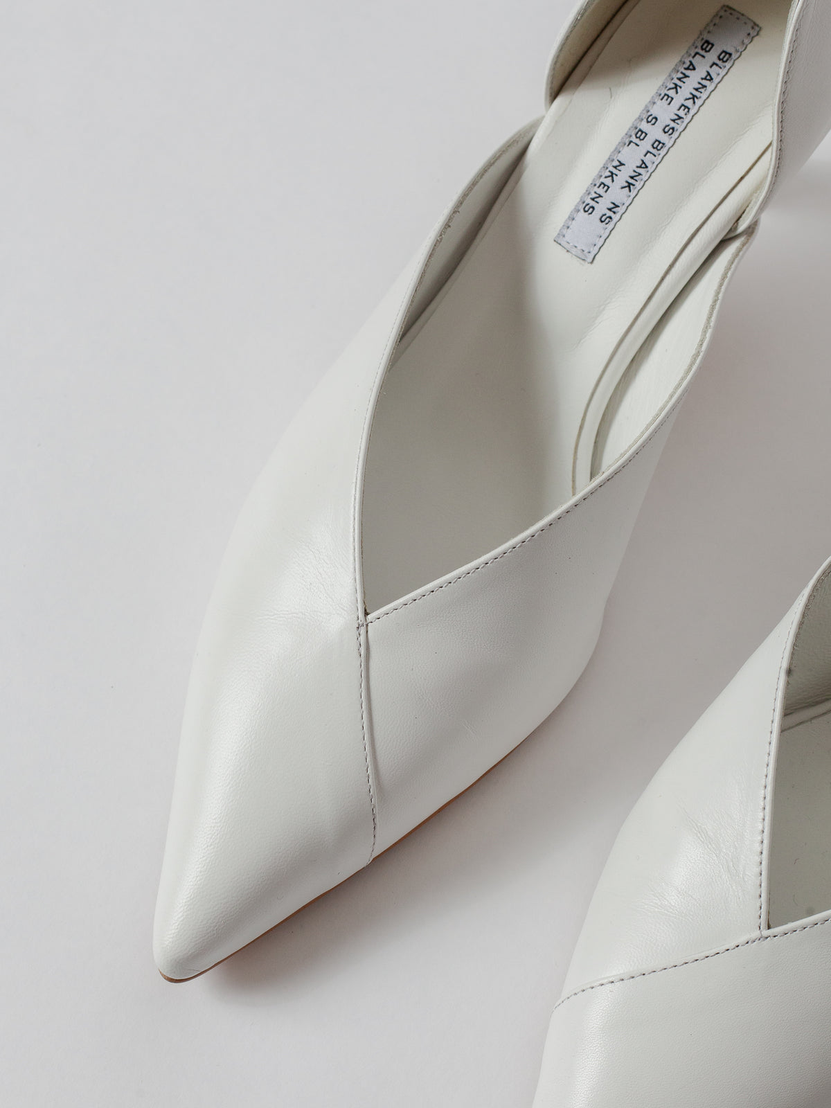 Blankens The Radford white White high-heeled shoes on a light gray background Weddings shoes White pointed-toe shoes on a light gray background