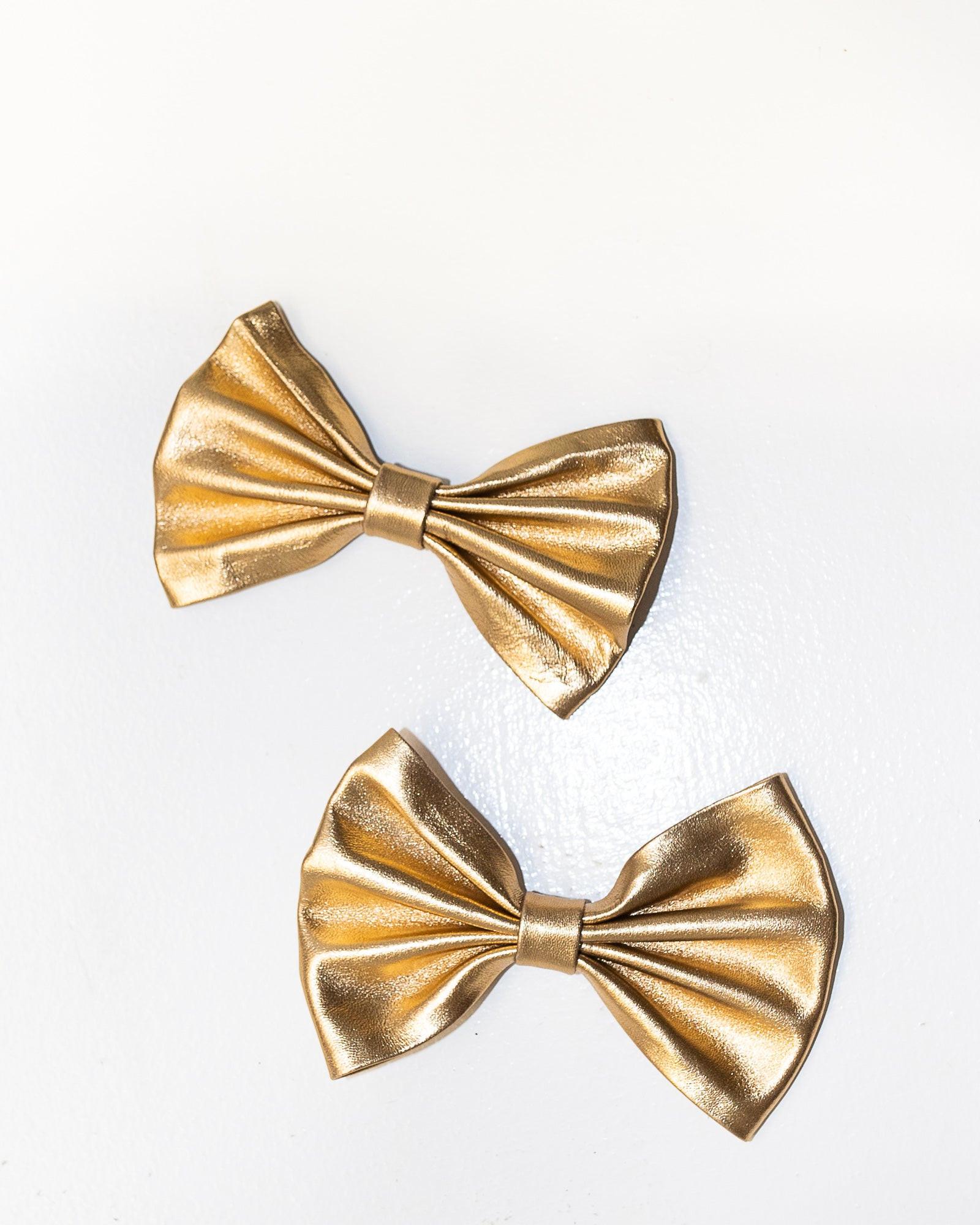 Blankens clip-on bows in gold leather