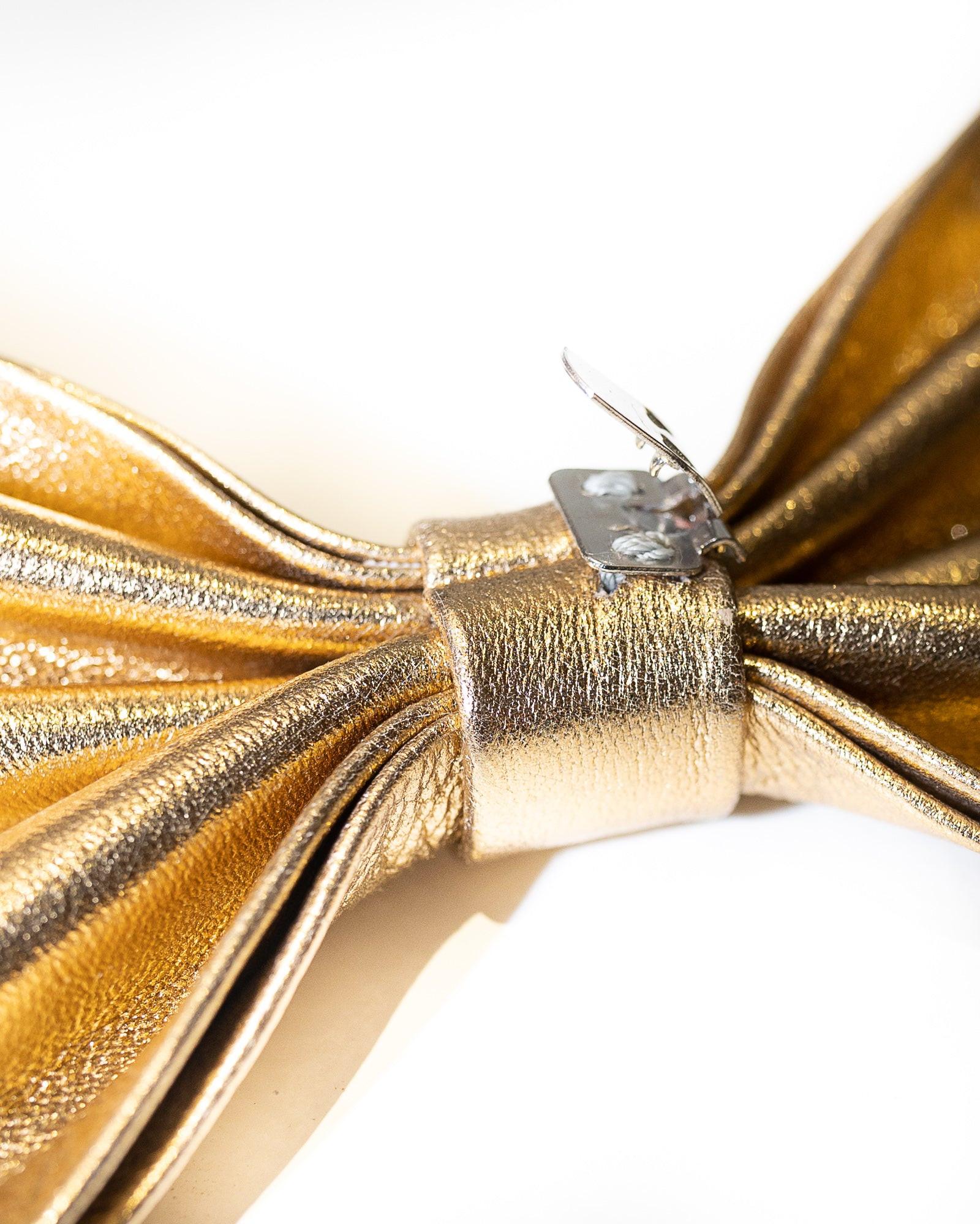 Blankens clip-on bows in gold leather